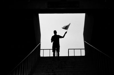 Low angle view of man walking on steps