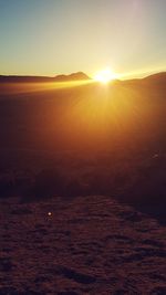 Scenic view of landscape against sky during sunset