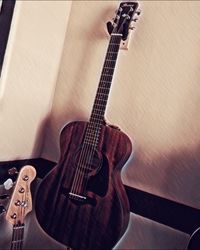 High angle view of guitar at home