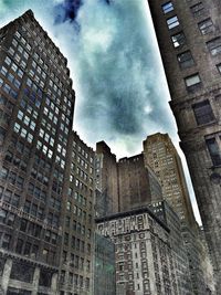 Low angle view of building against cloudy sky