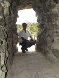 Portrait of young man on rock