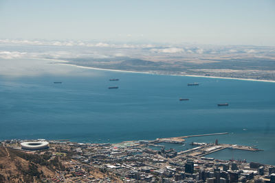 High angle view of sea and buildings against sky