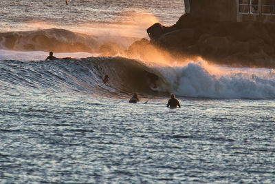 Scenic view of sea waves splashing on land