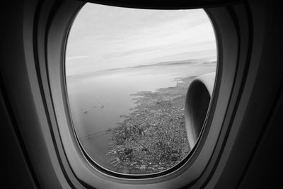 Close-up of airplane wing seen through window