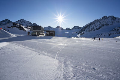 View of snow covered land against sky