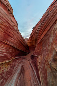 Low angle view of rock formation against sky