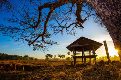 Gazebo on field against sky