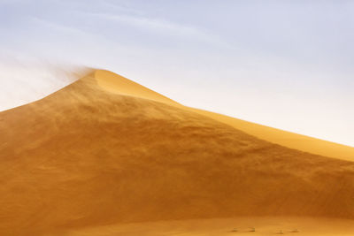 Scenic view of desert against sky