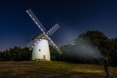 Windmill at night illuminated with a flashlight in germany krefeld, egelsberg, egelsberger mühle.