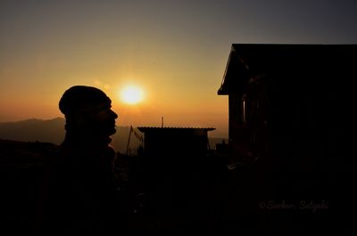 Silhouette man against sky during sunset