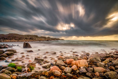 Scenic view of sea against sky at sunset