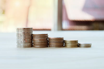 Stack of coins on table