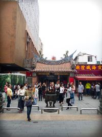 People at town square against clear sky