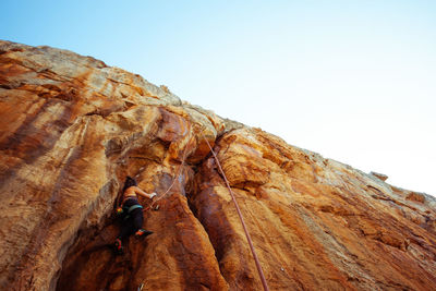 Low angle view of rock formations against clear sky