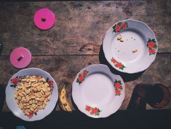 Directly above shot of peanuts in plate on table