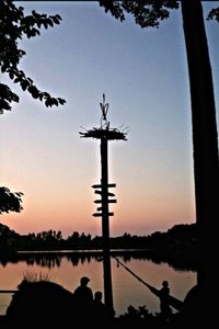 Scenic view of calm lake at sunset