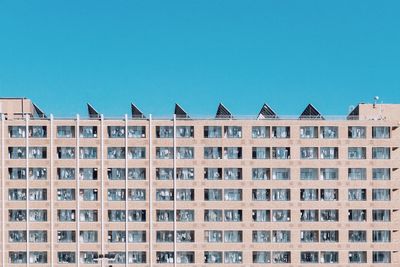 Low angle view of residential building against clear sky