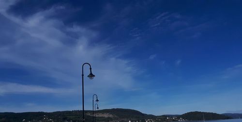 Low angle view of street light against sky