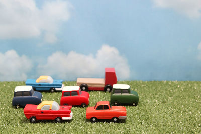 Red toy car on field