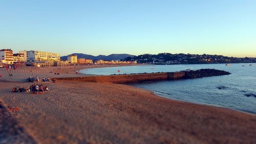 Scenic view of beach against clear sky