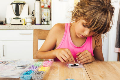 Girl playing with toys at home