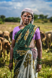 Portrait of man standing on field