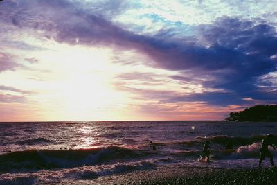 Scenic view of sea against cloudy sky