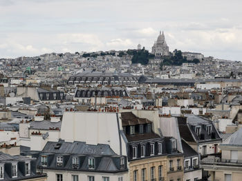 Paris cityscape from above. montmartre hill and sacre coer church stand out in the view