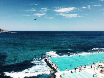 High angle view of people on beach against sky