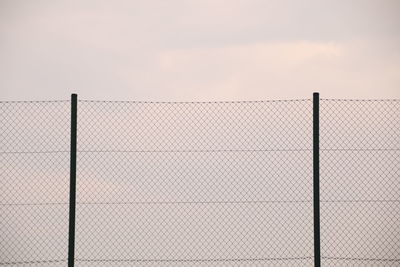 Chainlink fence against sky