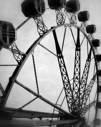 Low angle view of ferris wheel against sky