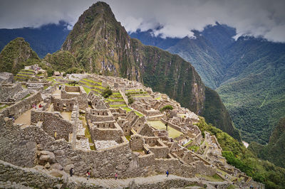 View of old ruins against cloudy sky