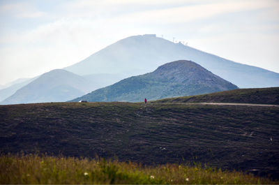 Scenic view of landscape and mountains against sky