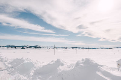 Scenic view of snow covered mountains against sky