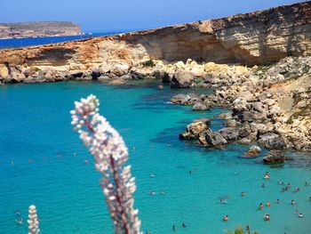 Scenic view of sea against rock formation