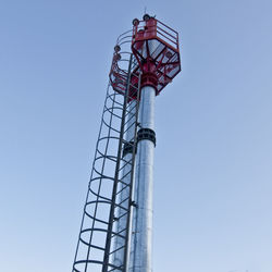 Low angle view of tower against clear blue sky