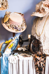 Close-up of fabric with sewing machine on table