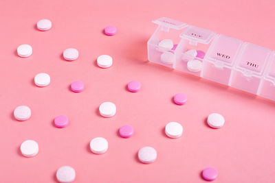 High angle view of pills on white background