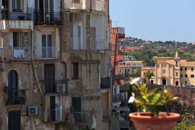 View of residential buildings in city against sky