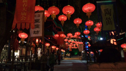 Illuminated red light at night