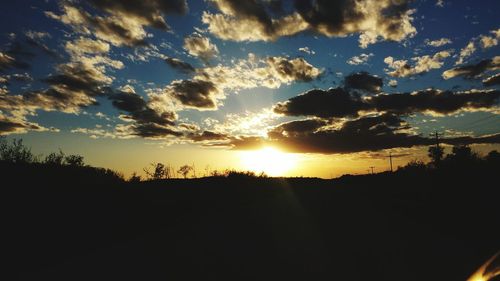 Scenic view of silhouette landscape against sky during sunset