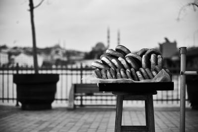 Close-up of food on table against sky in city