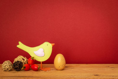 Close-up of fruits on table against wall