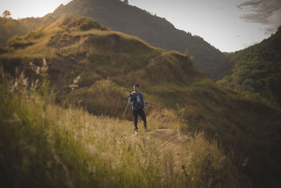 Rear view of man standing on land