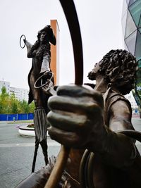 Statue against clear sky in city