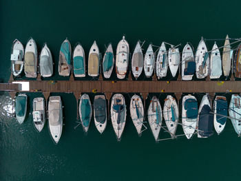Row of boats moored in lake