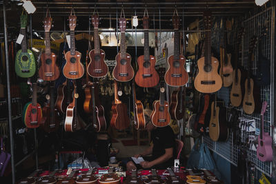 String instruments hanging in store