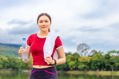 Portrait of smiling woman standing outdoors