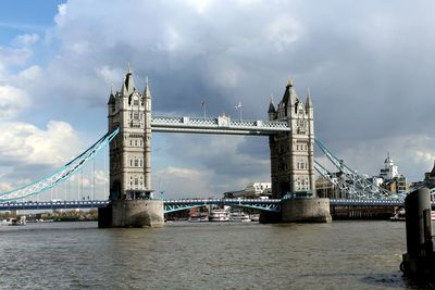 View of london bridge against cloudy sky