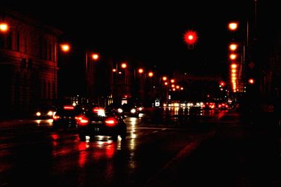 Traffic on city street at night